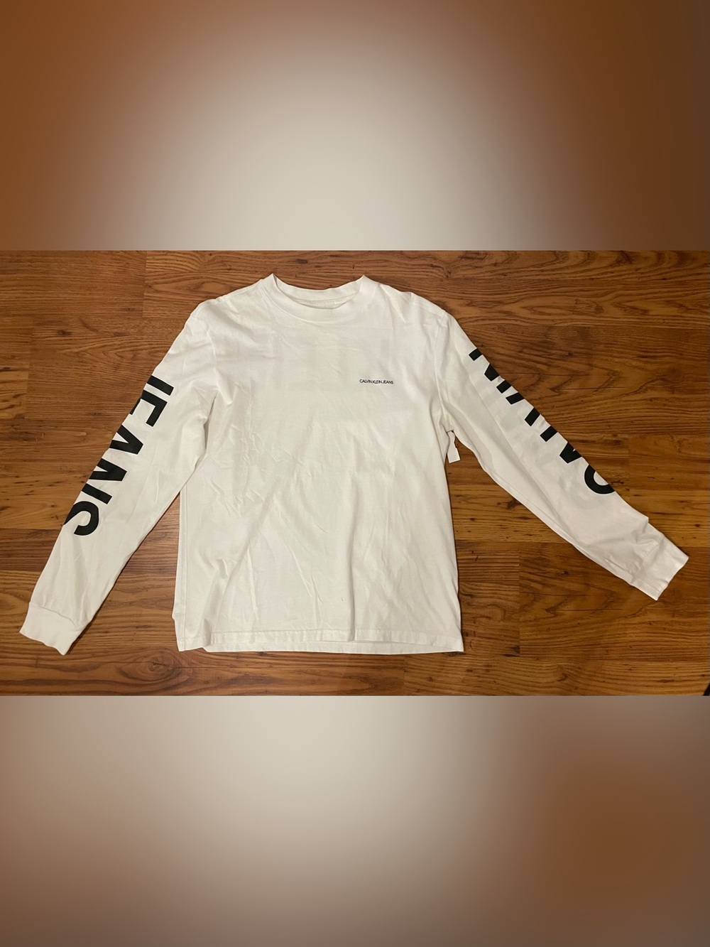 Calvin Klein Jeans White Long Sleeve Logo Tee with Sleeve Bold Black Lettering